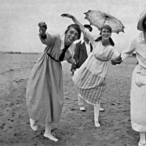 Three women posing on a beach