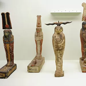 Wooden statuettes depicting Gods Ptah, Osiris and Seker bird