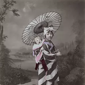 Young woman or nurse / nanny carrying a baby, Japan
