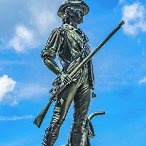 The Minute Man statue, Old North Bridge, Minute Man National Historical Park. First Battle American Revolution. Statue by Daniel Chester French, modeled on Isaac Davis Patriot Captain who died at bridge. (Editorial Use Only) Date: 27-12-2020