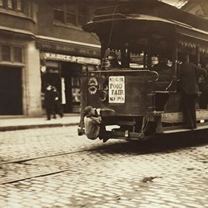 Child riding on a tram, Boston, 1909 C014 / 2047