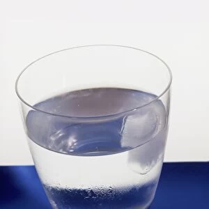 Water condensation on a glass of water