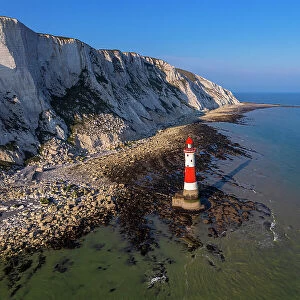Aerial view of the Beachy Head Lighthouse at low tide, Seven Sisters chalk cliffs, South Downs National Park, East Sussex, England, United Kingdom