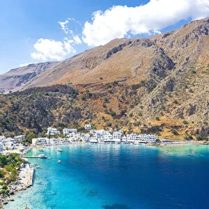 Aerial view of seaside village of Loutro nestled in the idyllic cove washed by turquoise sea, Crete island, Greek Islands, Greece, Europe