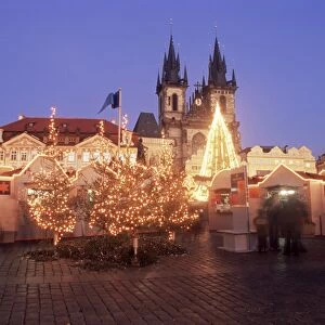 Christmas market and tree with Gothic Church of our Lady before Tyn at Staromestske namesti