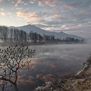 Clouds reflected in River Mera at dawn, Sorico, Como province, Lower Valtellina, Lombardy
