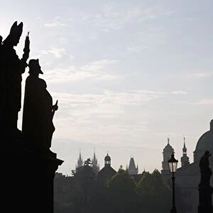 Early morning view of statues on Charles Bridge, Old Town, Prague, Czech Republic, Europe
