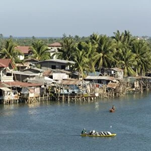 Fishermens stilt houses in wetlands at south end of Lingayen Gulf