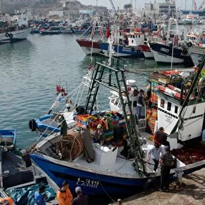 Fishing boat preparing to set sail from Tangier fishing harbour, Tangier, Morocco, North Africa, Africa