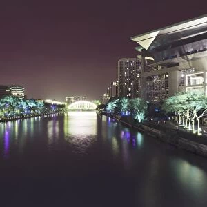 Illuminated architecture and reflections at night in Hangzhou City Center, Hangzhou