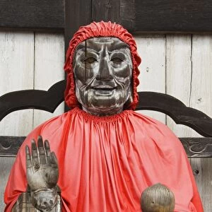 Jizo Buddha statue dressed in red cape