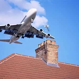 Low-flying aircraft over rooftops near London Heathrow Airport, Greater London
