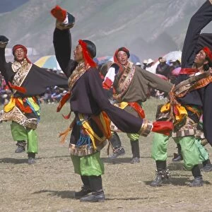 Men in traditional Tibetan dress, Yushu Horse Fetival, Qinghai Province, China, Asia