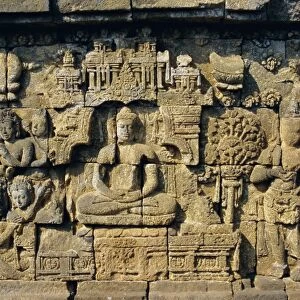 Relief carvings on frieze on outside wall of the Buddhist temple