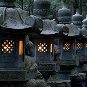Row of lighted stone lanterns in the Okunoin Temple cemetery at Koyasan (Mount Koya)
