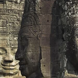 Stone statuary of human faces, Ta Prohm temple, Angkor, UNESCO World Heritage Site