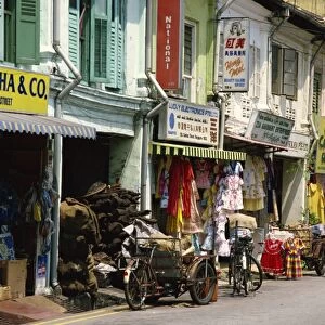 Street scene of shops and signs in Little India on