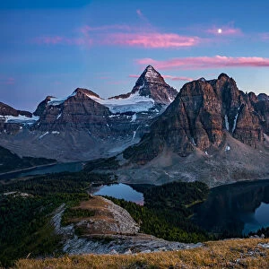 Sunset on top of Nub Peak, looking at Mount Assiniboine and the moon