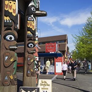 Totem pole on store, Pier 54, Seattle, Washington State, United States of America