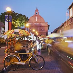 Trishaws passing in Town Square, Melaka, Malaysia, Southeast Asia, Asia