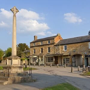 War Memorial stone cross on the High Street in the village of Broadway