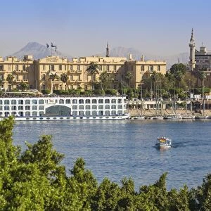 Egypt, Luxor, View of Nile cruise boats infront of The Winter Palace Hotel