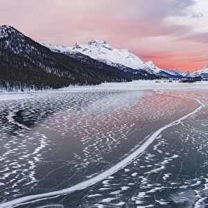 Frozen Lake Silvaplana at sunrise during the cold winter, Maloja, Engadine