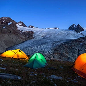 Illuminated tents camping close to Rutor (Ruitor) glacier, (Rutor