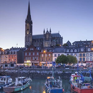 Ireland, County Cork, Cobh, St. Colmans Cathedral from Cobh Harbor, dusk