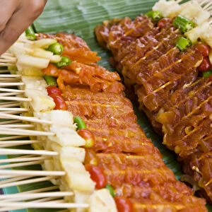 Kebabs, skewered meat for barbecue on street stall, Bangkok, Thailand