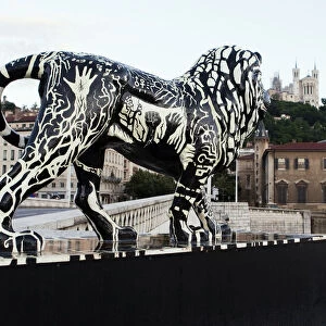 Lyon, France; A lion statue on a bridge over the Saone in Lyon France