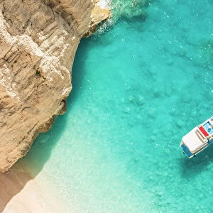 A man relaxing on his yacht docked at Navagio beach, Zakynthos, Ionian Islands, Greece