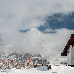 An old church on the top of the mountain in italian alps during winter season, Alta Badia