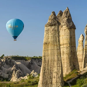 Scenic fairy chimneys landscape with hot air balloons, Goreme, Cappadocia, Turkey