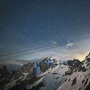 Skyway cableway station near Mont Blanc under a starry sky, Torino refuge