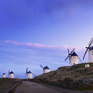 Spain, Castile, La Mancha, Consuegra, Windmills at dusk