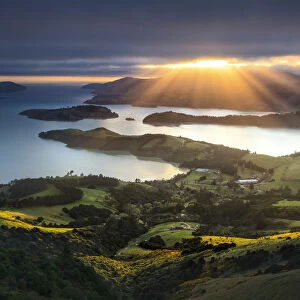 Sun rays breaking through clouds, from the Port Hills, Christchurch, New Zealand