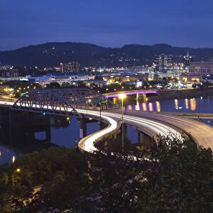 USA, West Virginia, Charleston, city and I-64 bridge, evening