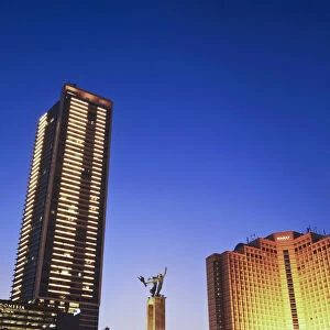 Welcome Monument and Grand Hyatt Hotel at dusk, Jakarta, Java, Indonesia
