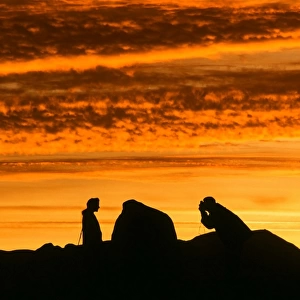 A couple at Castlerigg Stone Circle nerar Keswick in the Lake district at sunset UK