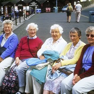 Old women on a bench in Bowness on Windermere, Lake District, UK