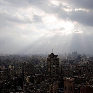 Clouds gather during a rain and cold spell over the capital Cairo