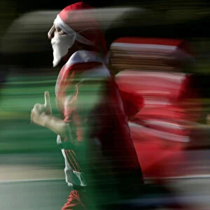 Participants dressed as Santa Claus take part in the annual race known as Run Santa Run