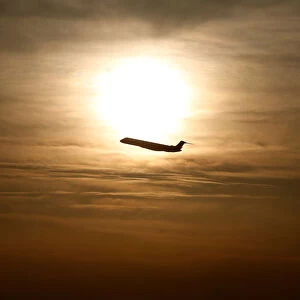 A plane is seen during sunrise at the international airport in Munich