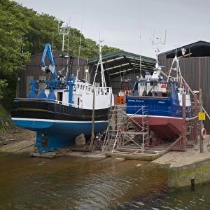Crystal River and Fidelity BH92 fishing trawlers in dry dock at harbour, Eyemouth, Berwickshire, Scottish Borders