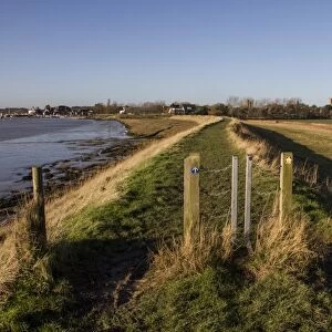 Metal swing gates on sea wall foot path, looking south to Orford, Suffolk