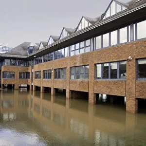 Office block built on floodplain with brick stilts to keep structure above water level during flooding, Forest Row