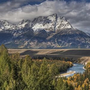 View of mountain range and forested river valley, Snake River, Grand Teton N. P. Wyoming, U. S. A. October