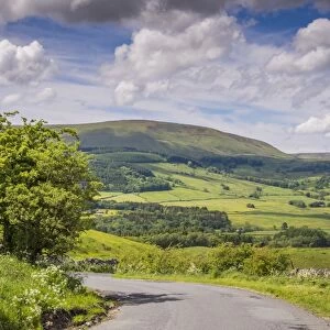 View of road and countryside, Hodder Valley, Hall Hill, Forest of Bowland, Lancashire, England, June