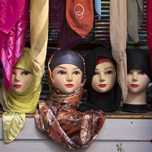 Africa, Morocco, Fes. Moroccan Head scarves on mannequin heads in market